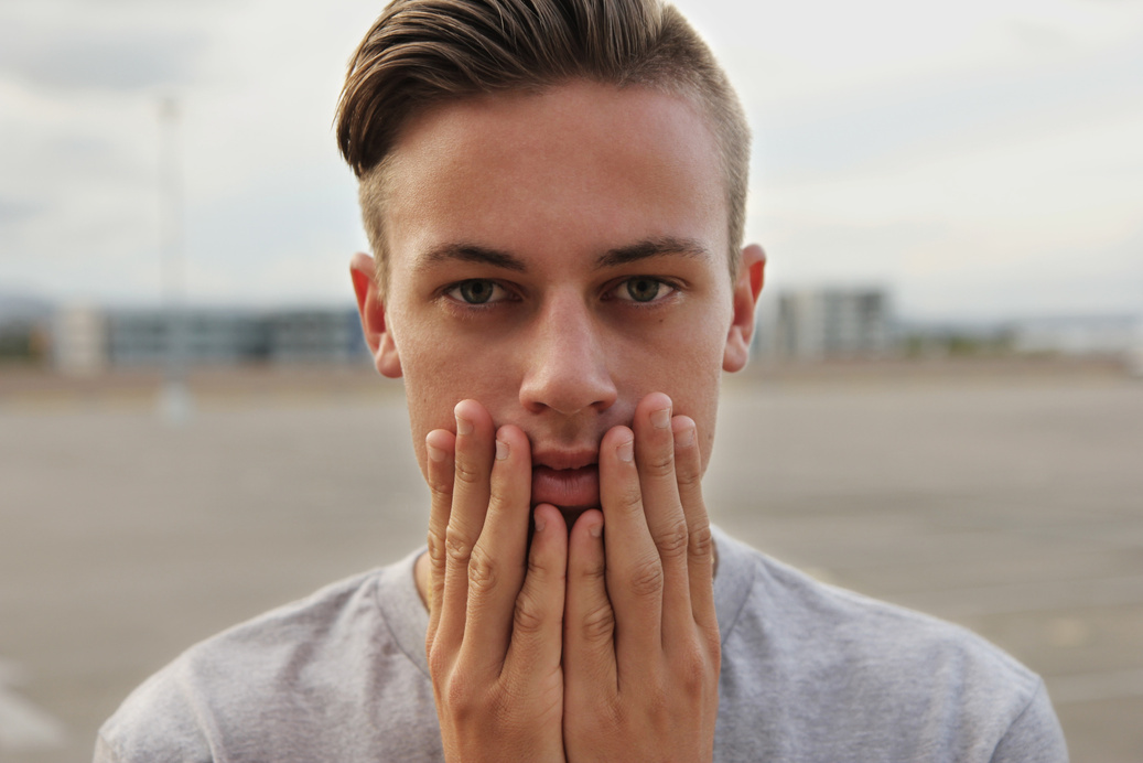 Portrait of Man Touching his Face